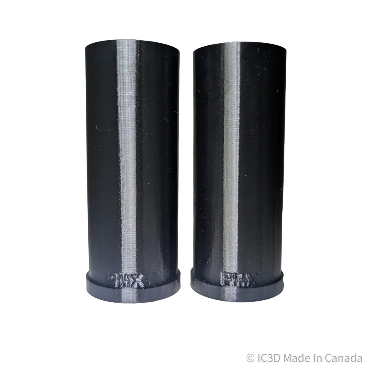 Pair of black 3D printed plastic cylindrical tubes on white background