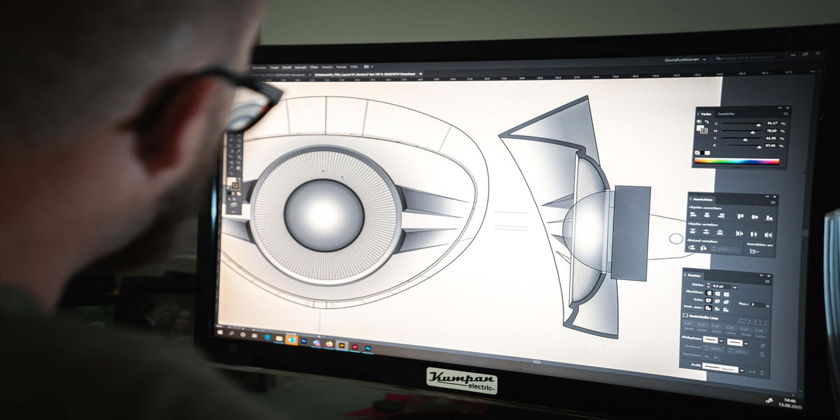 Person designing 3D model on computer screen with CAD software open